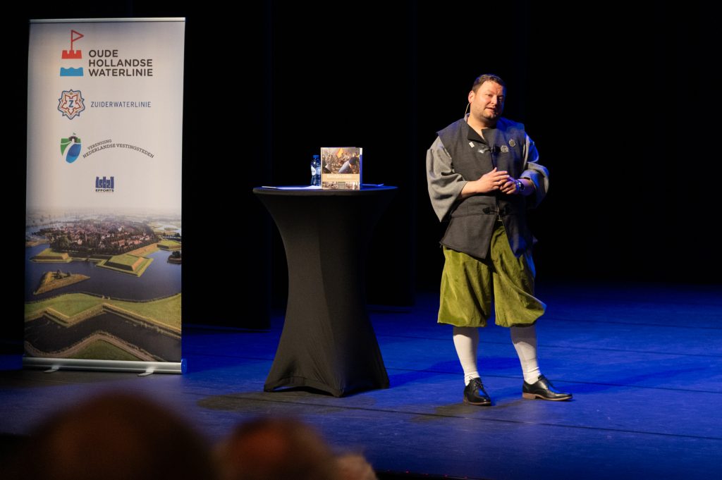 Foto van spreker tijdens het symposium.